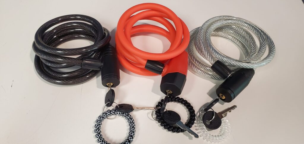 Picture shows three bike locks with attached keys